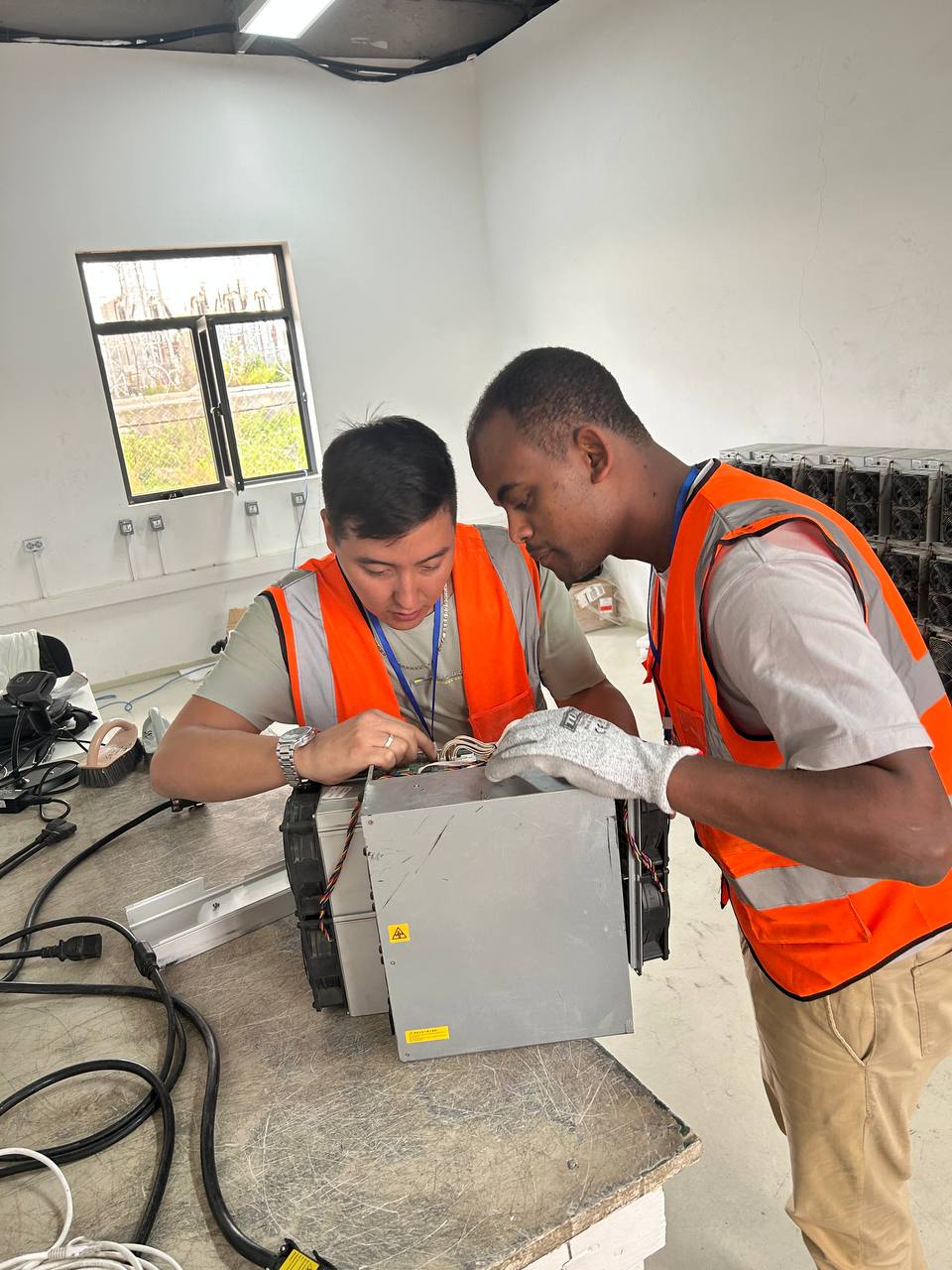 Technician repairing an ASIC Bitcoin miner